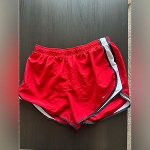 Red Nike running shorts
